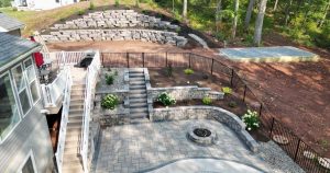 backyard hardscape ideas with stone patio and retaining walls